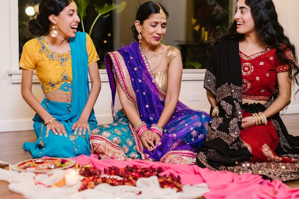 Indian family in traditional attire at ceremony